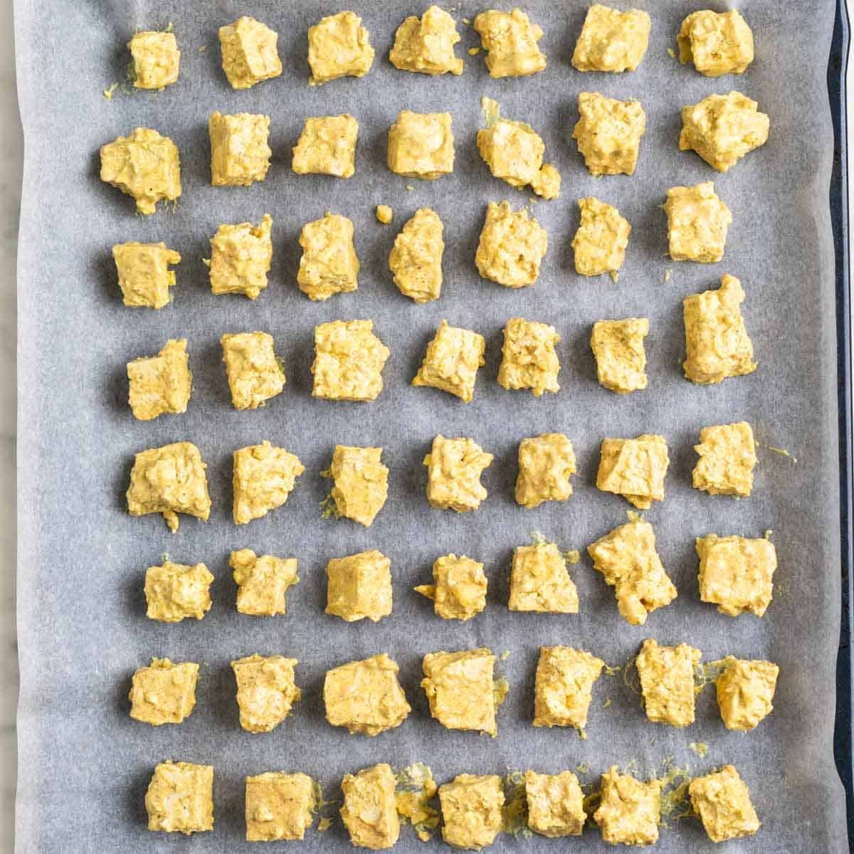 Marinated tofu on a baking sheet