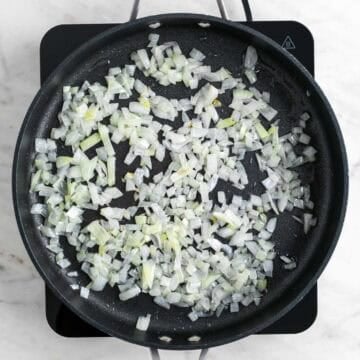 Chopped onion cooking in a skillet