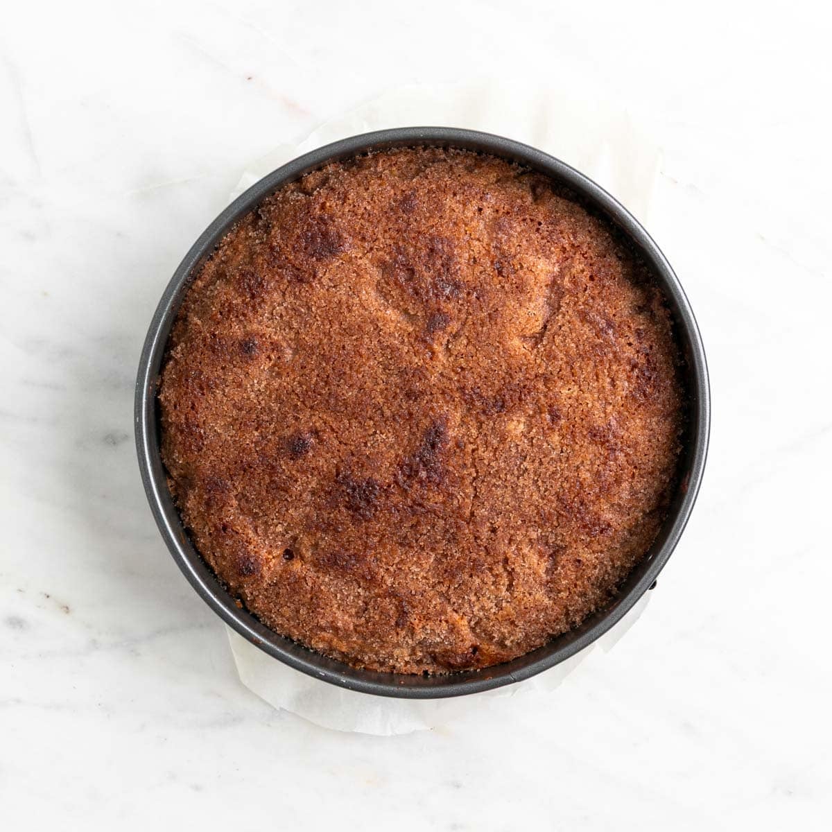 Baked vegan apple cake cooling on a wire rack