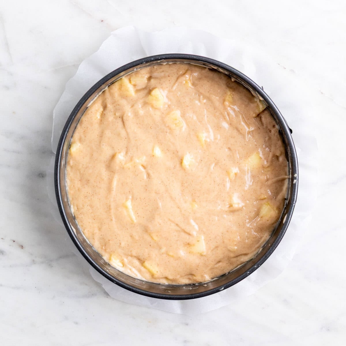 Apple cake batter in the pan