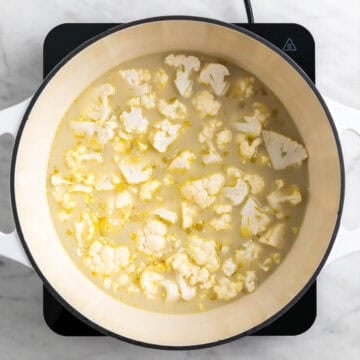 Cauliflower, broth, and plant milk in the pot