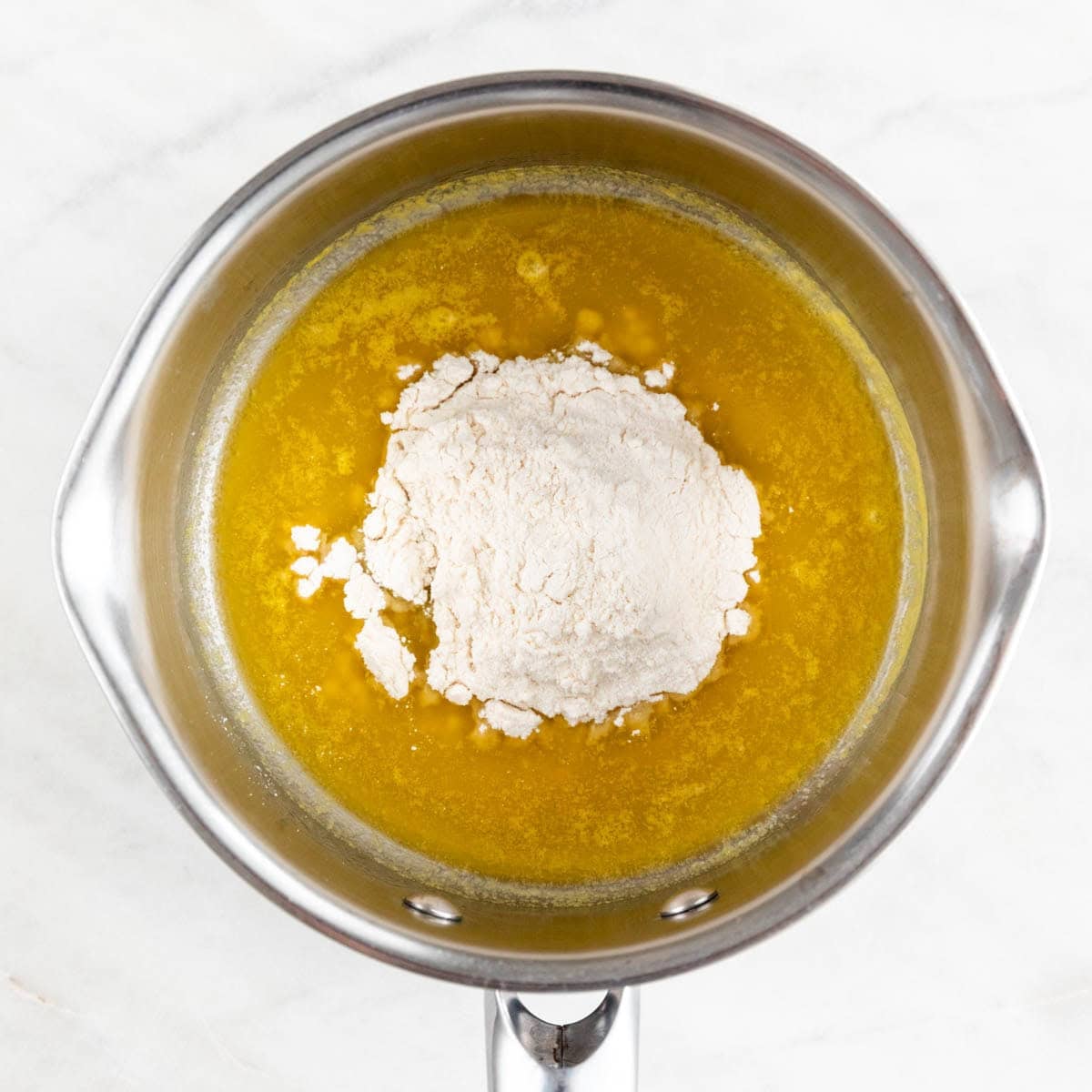 Vegan butter melting in a saucepan with flour