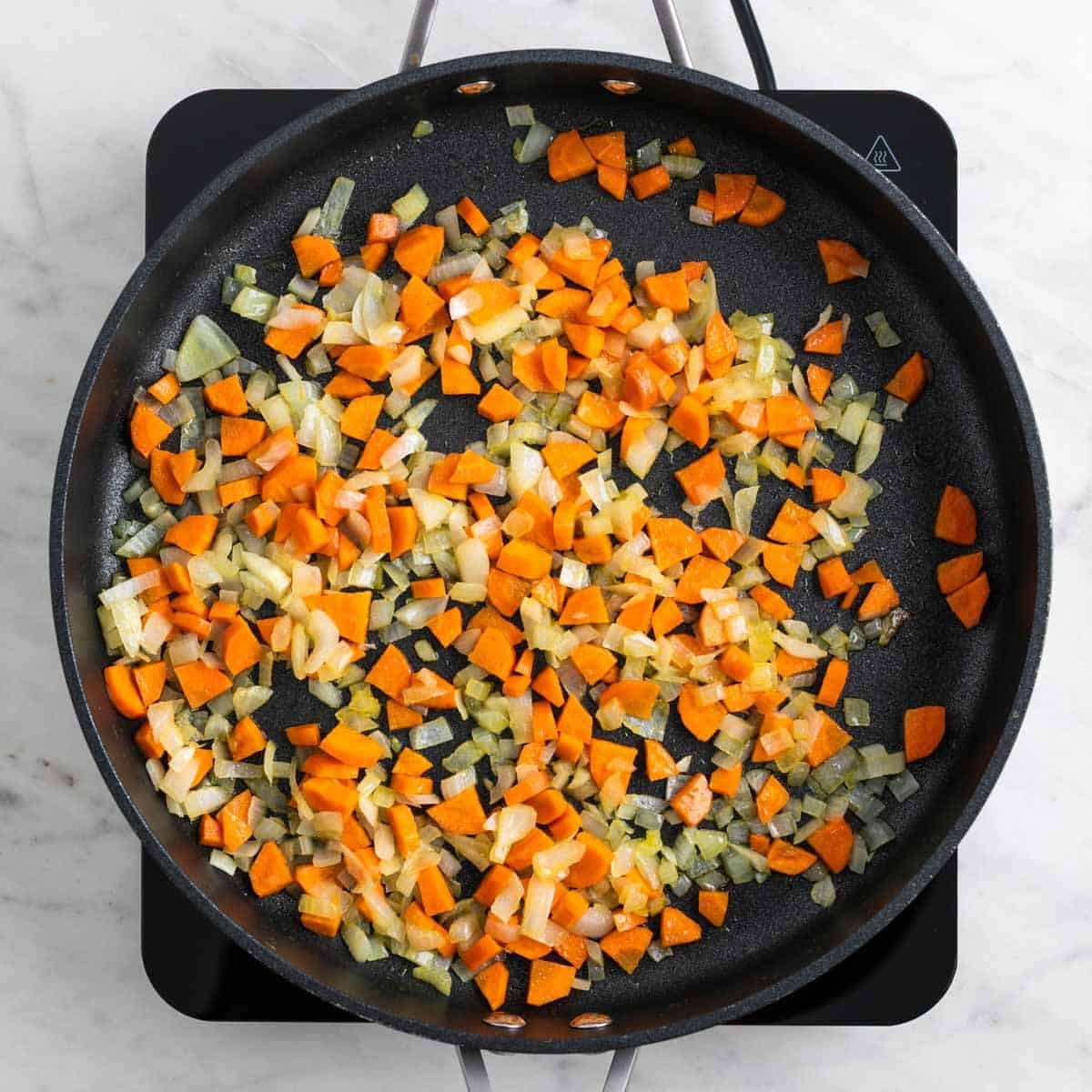 Onion and carrots cooking